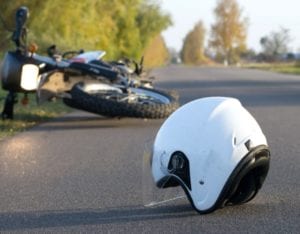 motorcycle accident on side of open road