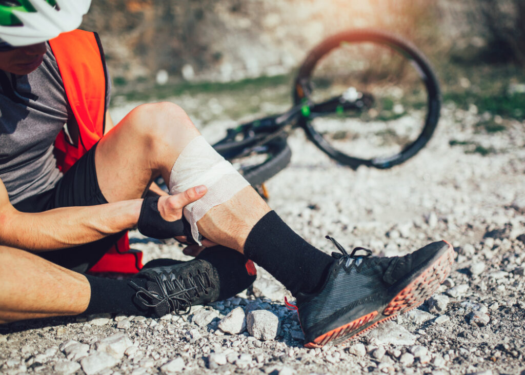 Man suffering bike injury in the summer time.
