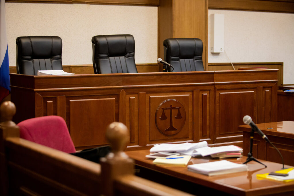A courtroom in a Russian court, an empty judge's chair