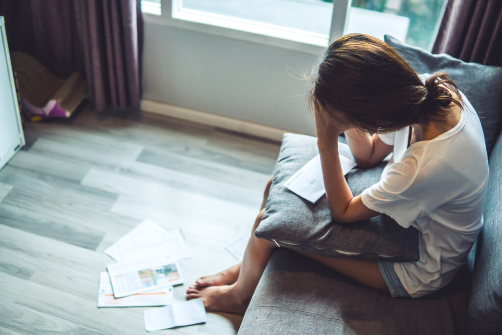 Young women worried about bills and debr stacking up. Unable to pay credit cards and loans
