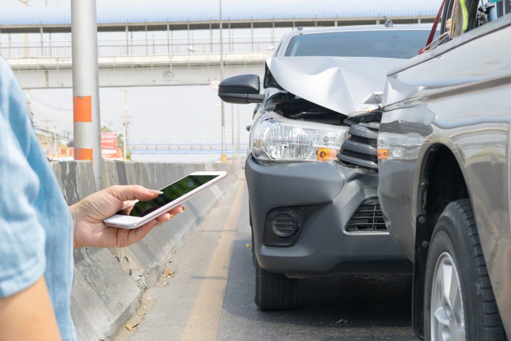 Driver exchanging insurance information after a car accident