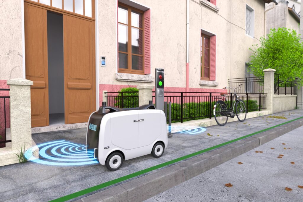 Autonomous food delivery robot on a sidewalk near pedestrians in a California city