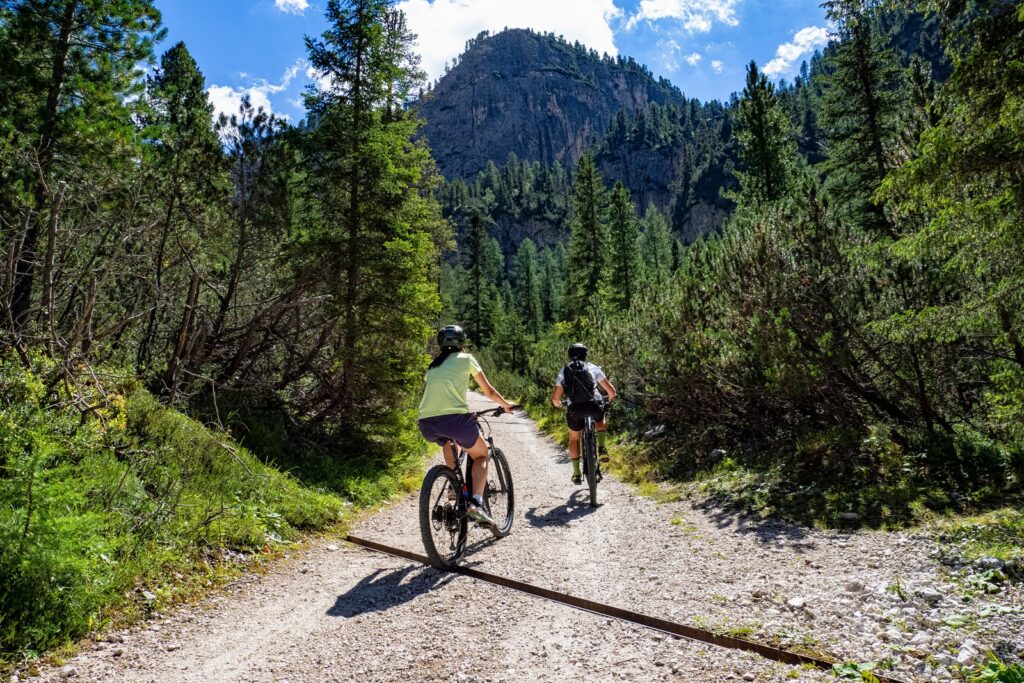 Cyclist riding an e-bike on a mountain trail in California
