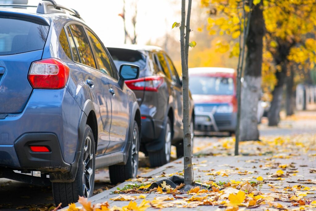 Cars parked along a city street, illustrating a car accident claim involving an illegally parked vehicle