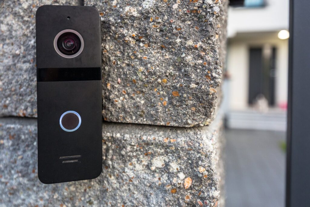 Ring doorbell camera mounted outside a home, capturing footage of the street